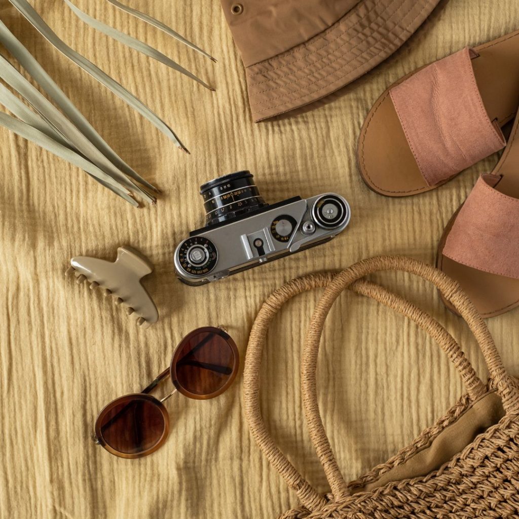 Summer essentials with camera and sandals