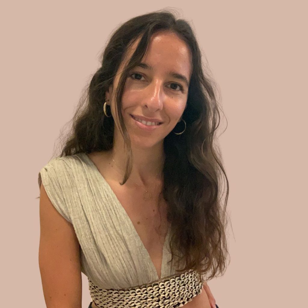 Smiling woman in natural-toned outfit